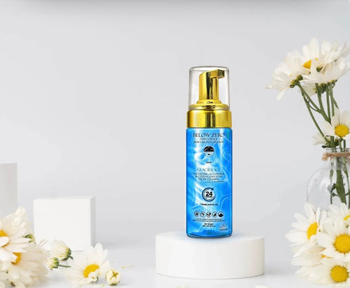 Below Zero Glacier Ice Lava Foam Cleanser styled with flowers on white background