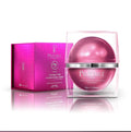 Prédiré Paris Skin Collagen Transformation Mask - spherical metallic rose-pink dome jar in clear acrylic case next to fuchsia croc-embossed gift box on white background