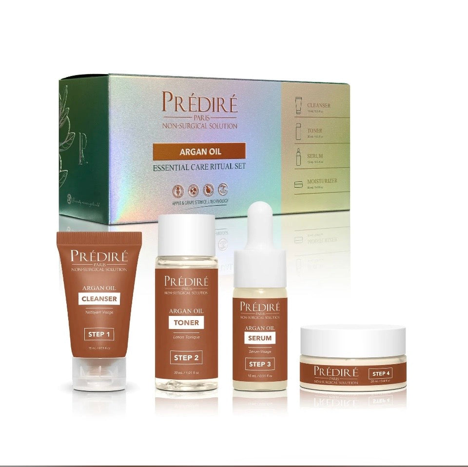 Prédiré Paris Argan Oil Essential Care Ritual Set - all 4 products displayed in front of holographic iridescent gift box