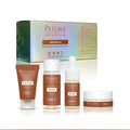 Prédiré Paris Argan Oil Essential Care Ritual Set - all 4 products displayed in front of holographic iridescent gift box