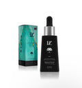 BZ Daily Essence Retinol Tightening Facial Serum - matte black dropper bottle next to teal marble and gold gift box on white background