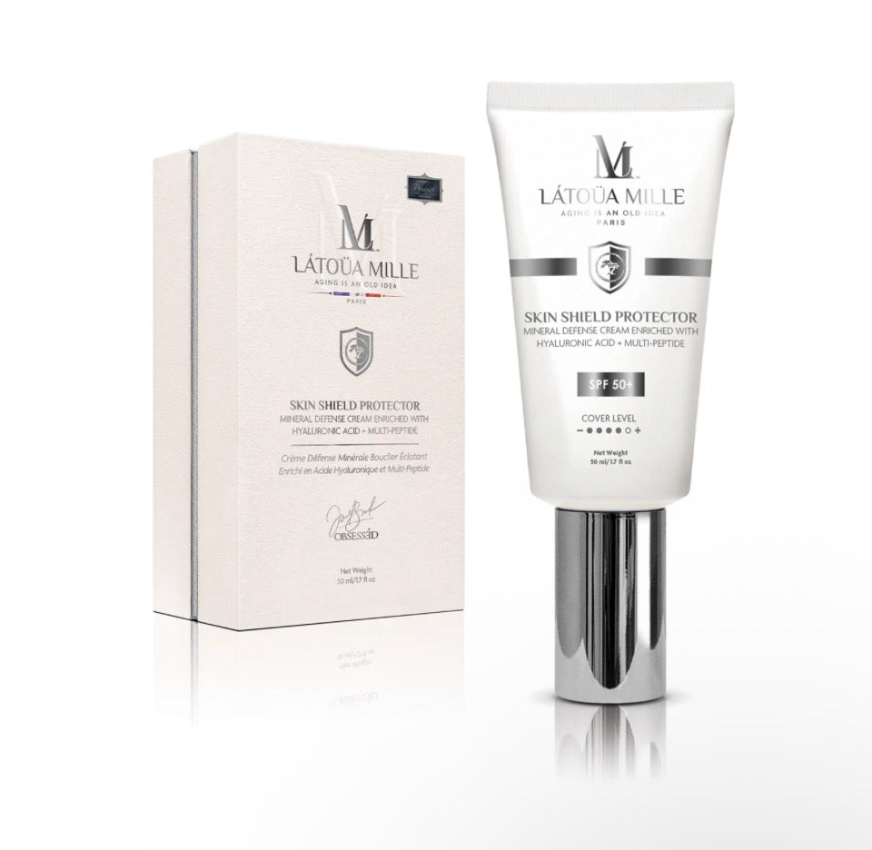 Látoüa Mille Skin Shield Protector SPF 50+ - white tube with chrome base next to white gift box with silver shield emblem on white background