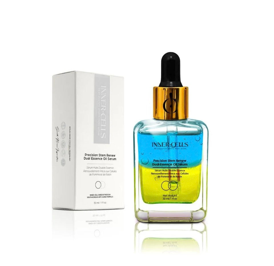 Inner-Cells Precision Stem Renew Dual-Essence Oil Serum - clear glass bottle with blue and yellow dual-phase layers and gold collar next to white Inner-Cells gift box