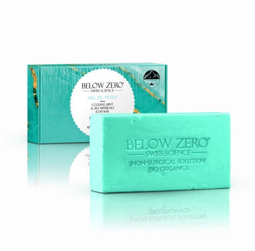 Below Zero Swiss Science Arctic Fresh Cooling Mint & Sea Minerals Soap Bar - glacier-mint green embossed soap bar with Below Zero Swiss Science Non-Surgical Solution Bio Organica branding next to teal gift box with gold foil accents and Swiss mountain peak emblem