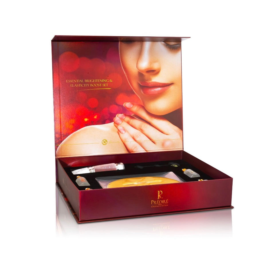 Prédiré Paris Essential Brightening & Elasticity Boost Set - open crimson magnetic box showing velvet-lined interior with editorial photography inside lid and products arranged inside